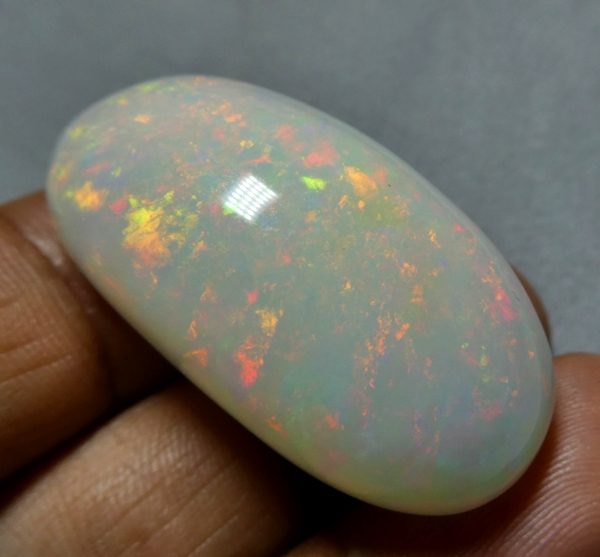 65.65CT UNTREATED JUMBO RAINBOW FLASHING 100% NATURAL CRYSTAL OPAL