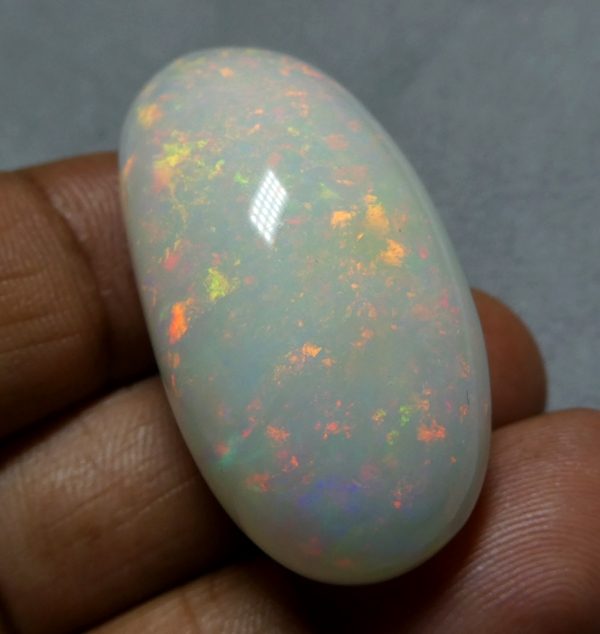 65.65CT UNTREATED JUMBO RAINBOW FLASHING 100% NATURAL CRYSTAL OPAL