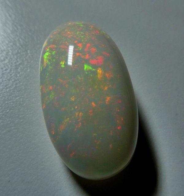 65.65CT UNTREATED JUMBO RAINBOW FLASHING 100% NATURAL CRYSTAL OPAL